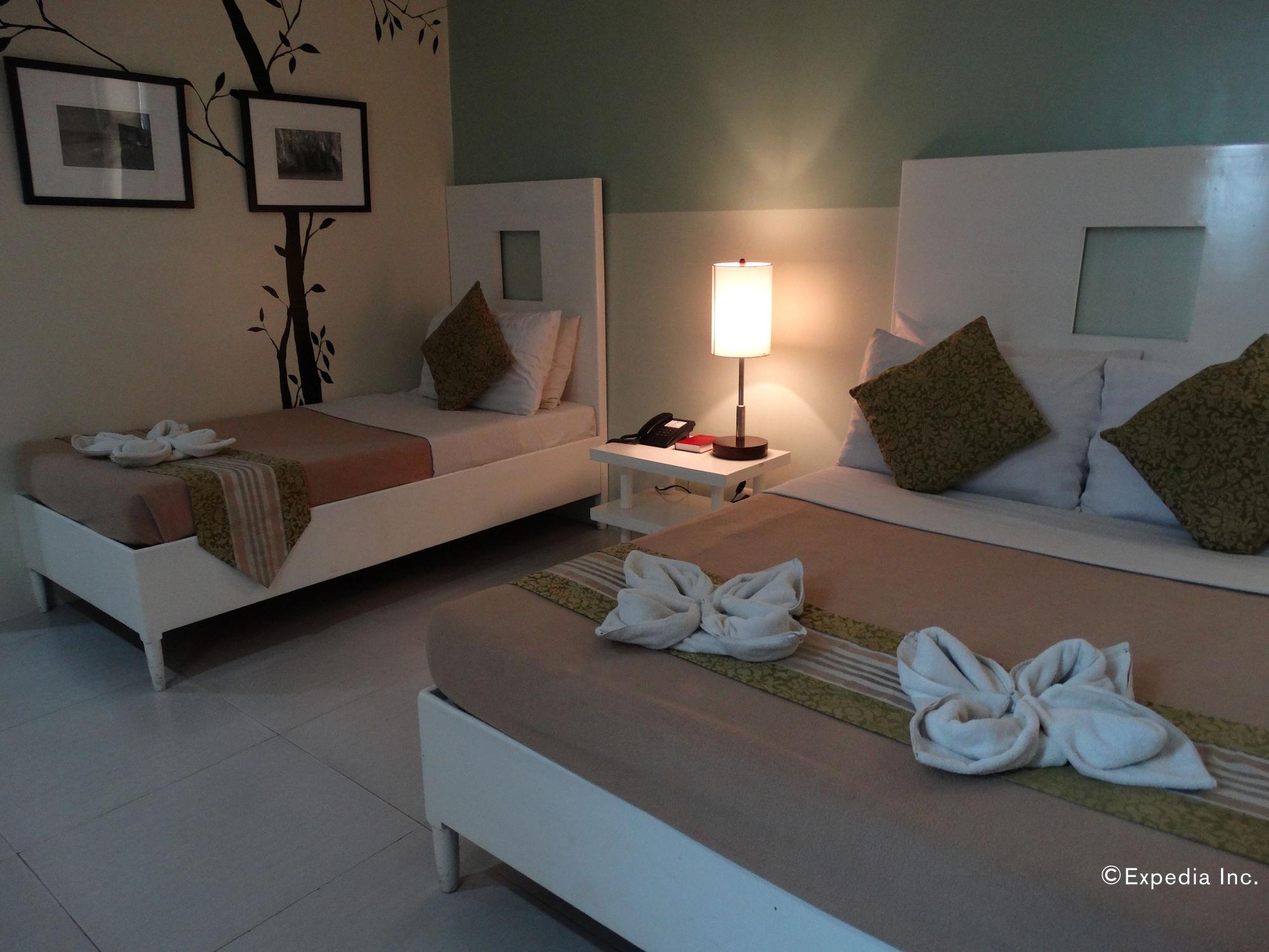 Empire Suites Hotel Puerto Princesa Buitenkant foto