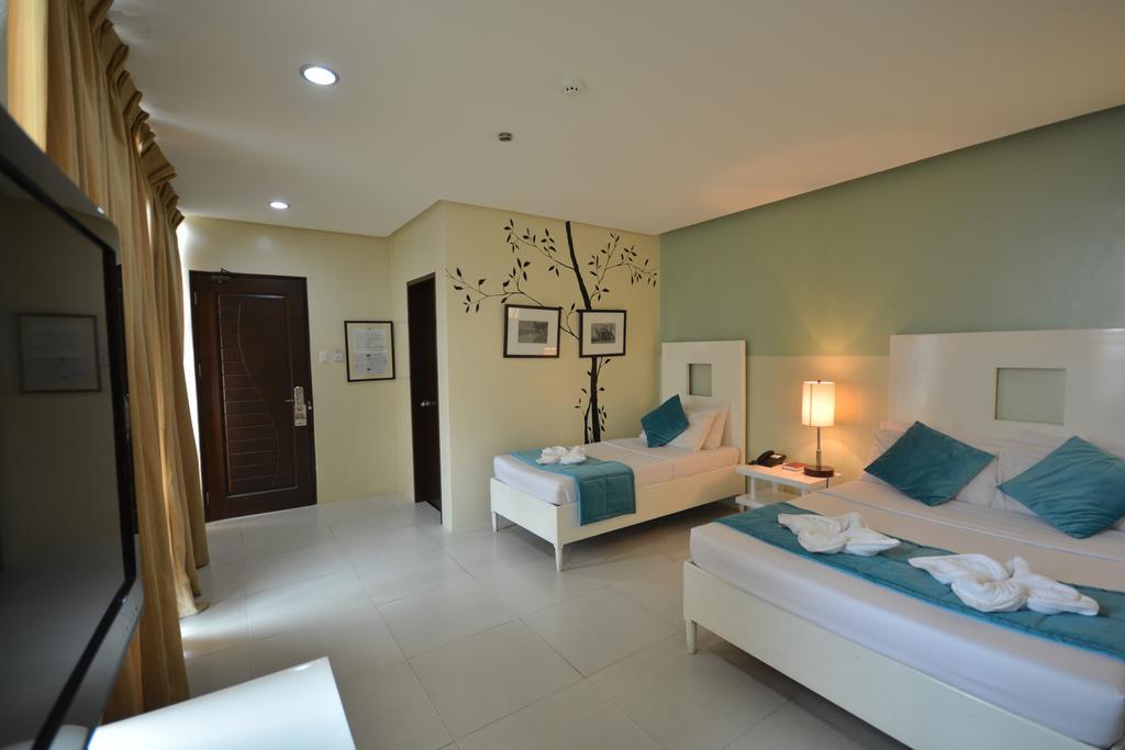 Empire Suites Hotel Puerto Princesa Buitenkant foto